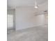 Spacious living room featuring tile flooring, white walls, access to the outdoors, and a ceiling fan at 10613 S 41St Pl, Phoenix, AZ 85044