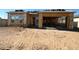 New home under construction with a partial roof and visible wood framework for windows and garage at 11410 E Utah Ave, Mesa, AZ 85212