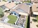 Aerial view of a backyard, showcasing the synthetic grass, pergola with outdoor furniture and privacy fence at 11601 W Bloomfield Rd, El Mirage, AZ 85335