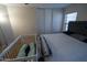 This bedroom offers neutral decor and a ceiling fan, and plush carpeting at 11601 W Bloomfield Rd, El Mirage, AZ 85335