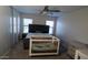 This bedroom offers neutral decor and a ceiling fan, and plush carpeting at 11601 W Bloomfield Rd, El Mirage, AZ 85335