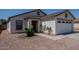 Charming single-story home featuring a two-car garage, neutral paint, and low maintenance desert landscaping at 11601 W Bloomfield Rd, El Mirage, AZ 85335