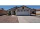 Charming single-Gathering home featuring a well-maintained front yard and a two-car garage at 11601 W Bloomfield Rd, El Mirage, AZ 85335