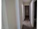Long hallway with doors to multiple rooms at 11601 W Bloomfield Rd, El Mirage, AZ 85335