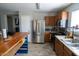 Charming kitchen features stainless steel appliances, a breakfast bar, and ample counter space at 11601 W Bloomfield Rd, El Mirage, AZ 85335