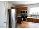 Kitchen features stainless steel appliances, oak cabinets, and light countertops at 11601 W Bloomfield Rd, El Mirage, AZ 85335