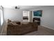 Spacious living room featuring neutral walls and carpet and a view into another living space at 11601 W Bloomfield Rd, El Mirage, AZ 85335