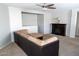 Living room featuring neutral walls and carpet and a fireplace at 11601 W Bloomfield Rd, El Mirage, AZ 85335