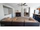 Living room featuring neutral walls and carpet, fireplace, and view into kitchen at 11601 W Bloomfield Rd, El Mirage, AZ 85335