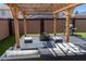 Relaxing outdoor space with a pergola, a cozy fire pit, and an outdoor seating area for entertainment at 11601 W Bloomfield Rd, El Mirage, AZ 85335