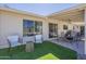 Beautiful backyard patio with modern chairs and a fire pit at 12234 S Pewaukee St, Phoenix, AZ 85044