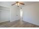 This bedroom is spacious and features hard wood floors and ceiling fan at 12234 S Pewaukee St, Phoenix, AZ 85044
