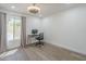This simple bedroom has hard wood floors and a modern ceiling fan at 12234 S Pewaukee St, Phoenix, AZ 85044
