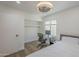 This cozy bedroom is perfect for studying, complete with desk and overhead shelving at 12234 S Pewaukee St, Phoenix, AZ 85044