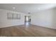 Bright living room featuring hardwood floors, recessed lighting, and neutral wall color with artwork at 12234 S Pewaukee St, Phoenix, AZ 85044