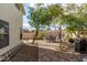 The backyard features patio dining and mature landscaping at 13864 W Ironwood St, Surprise, AZ 85374