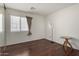 A bright bedroom with hardwood floors is the perfect space for sleep and relaxation at 13864 W Ironwood St, Surprise, AZ 85374