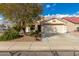 Inviting one story home with low maintenance desert landscaping, and two-car garage at 13864 W Ironwood St, Surprise, AZ 85374