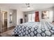This main bedroom features a full-length mirror and sliding glass door access to the backyard at 13864 W Ironwood St, Surprise, AZ 85374