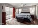 This main bedroom boasts hardwood floors, natural light, and a decorative ceiling fan at 13864 W Ironwood St, Surprise, AZ 85374