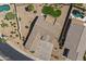 Aerial view of home showing roof, backyard and neighborhood pools at 14621 W Catalina Dr, Goodyear, AZ 85395