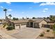 Aerial view of a charming single-Gathering home with desert landscaping and a three car garage at 14621 W Catalina Dr, Goodyear, AZ 85395