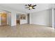 Spacious living room with tile flooring and neutral walls at 14621 W Catalina Dr, Goodyear, AZ 85395