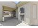 View of covered patio featuring neutral walls and a security screen door at 14621 W Catalina Dr, Goodyear, AZ 85395