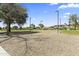 A sandy volleyball court provides recreational opportunities within a well-maintained park setting at 14621 W Catalina Dr, Goodyear, AZ 85395