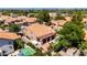Expansive aerial view highlighting home, pools, covered patio, RV and lush landscaping at 1521 W Kent Dr, Chandler, AZ 85224