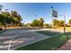 A vibrant outdoor basketball court in a neighborhood community park with clear blue skies at 1521 W Kent Dr, Chandler, AZ 85224