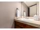 A bathroom featuring a single sink vanity and neutral color scheme at 1521 W Kent Dr, Chandler, AZ 85224