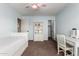 Bedroom with a comfortable bed, a stylish white bookcase, and a matching desk with chair for a cozy ambiance at 1521 W Kent Dr, Chandler, AZ 85224