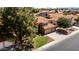 Beautiful single-Gathering home featuring lush landscaping, a red tile roof, and a two-car garage at 1521 W Kent Dr, Chandler, AZ 85224