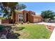 Charming two-story home featuring a well-kept lawn and a convenient three-car garage at 1521 W Kent Dr, Chandler, AZ 85224