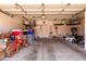 Spacious garage with ample storage shelves and a bicycle, perfect for organization and hobbies at 1521 W Kent Dr, Chandler, AZ 85224
