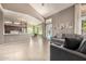 A living room showcases adjacent kitchen and dining areas, gray sofas, and tile flooring at 1521 W Kent Dr, Chandler, AZ 85224
