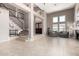 Bright living area with high ceilings, a fireplace, and stylish neutral-toned furniture at 1521 W Kent Dr, Chandler, AZ 85224
