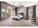 A spacious primary bedroom features a ceiling fan, curtains, carpet and outside access at 1521 W Kent Dr, Chandler, AZ 85224
