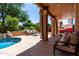 Inviting outdoor patio featuring comfortable seating, perfect for relaxing and enjoying the backyard view at 1521 W Kent Dr, Chandler, AZ 85224