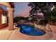 Sparkling pool and lush landscaping create a private backyard oasis at 1521 W Kent Dr, Chandler, AZ 85224