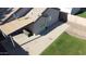 Home's backyard featuring a covered patio, well-kept lawn, and convenient side yard access at 15537 W Port Royale Ln, Surprise, AZ 85379