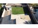 Detailed aerial view of home showcasing the backyard, patio, roof, and well-maintained yard at 15537 W Port Royale Ln, Surprise, AZ 85379