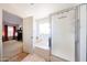 Relaxing bathroom with a soaking tub, a walk-in shower, and a seamless transition to the main bedroom at 15537 W Port Royale Ln, Surprise, AZ 85379