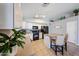 Bright and functional kitchen featuring ample counter space, tile floors, and a breakfast bar at 15537 W Port Royale Ln, Surprise, AZ 85379