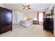 Spacious main bedroom with a ceiling fan, neutral tones, plush carpet, and inviting furnishings for a relaxing retreat at 15537 W Port Royale Ln, Surprise, AZ 85379