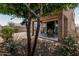 Charming backyard featuring a covered patio, mature trees, and low-maintenance landscaping at 1723 N Hillcrest --, Mesa, AZ 85201