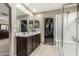 Bathroom features a double sink vanity, walk-in closet, and a glass enclosed shower at 1723 N Hillcrest --, Mesa, AZ 85201