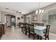 Bright dining room with elegant tile flooring and a formal dining table for eight guests at 1723 N Hillcrest --, Mesa, AZ 85201