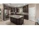 Well-equipped kitchen features a large center island, stainless steel appliances and granite countertops at 1723 N Hillcrest --, Mesa, AZ 85201